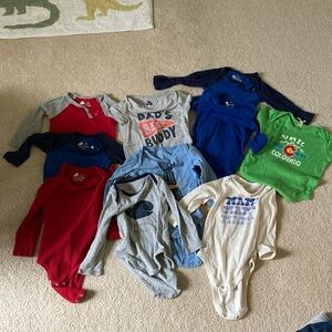 10 onesies mostly Primary, sizes 12-24 months see pictures
